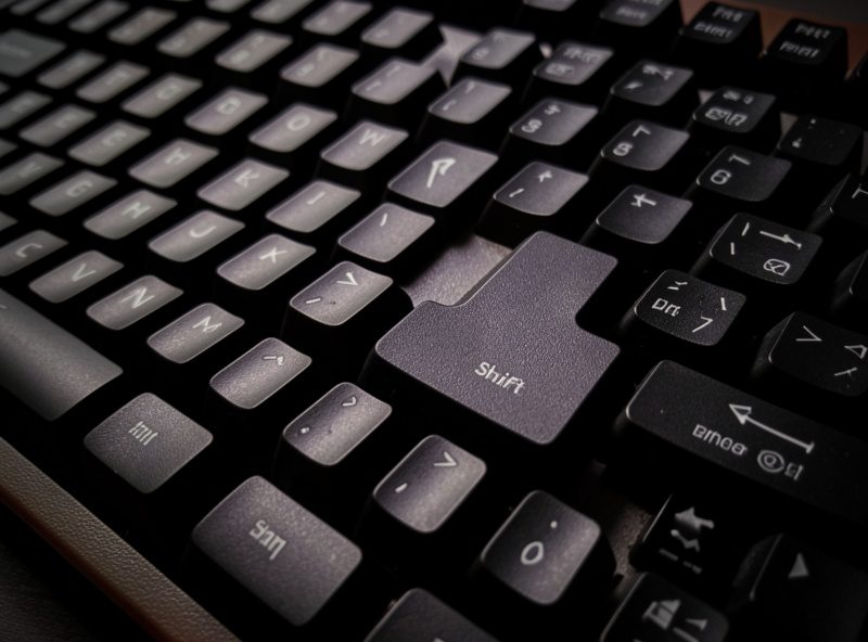 Close-up of the compressed right side of a 75 percent keyboard showing the shortened shift key and vertical navigation column