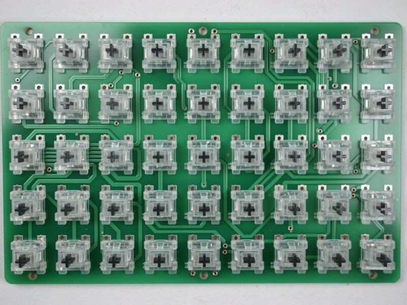 Mechanical keyboard PCB with switch LED slots pointing toward the top of the board