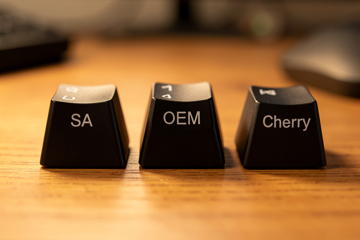 SA, OEM and Cherry profile keycaps side by side showing height differences